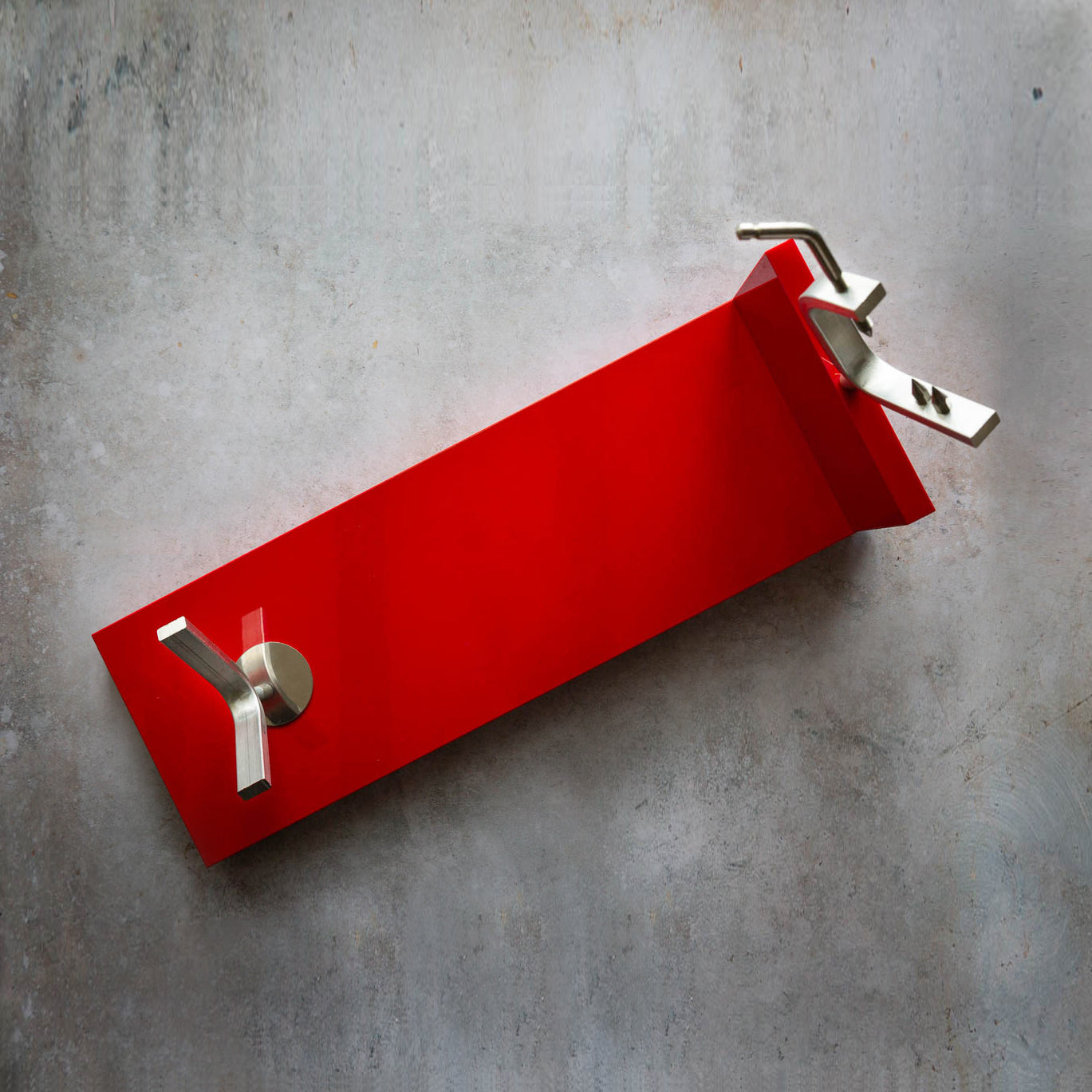 Red Ham Stand on grey background. Silver metal holder ends