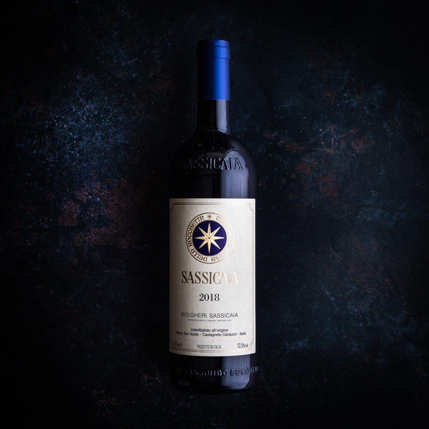 Sassicaia Tuscan Wine Bottle on a dark background.