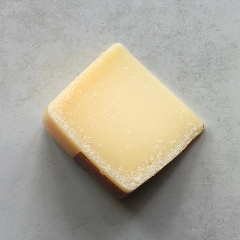 PECORINO TOSCANO D.O.P MATURE cheese wedge with aged rind and firm texture, ideal for cheese boards or grating in Italian dishes.