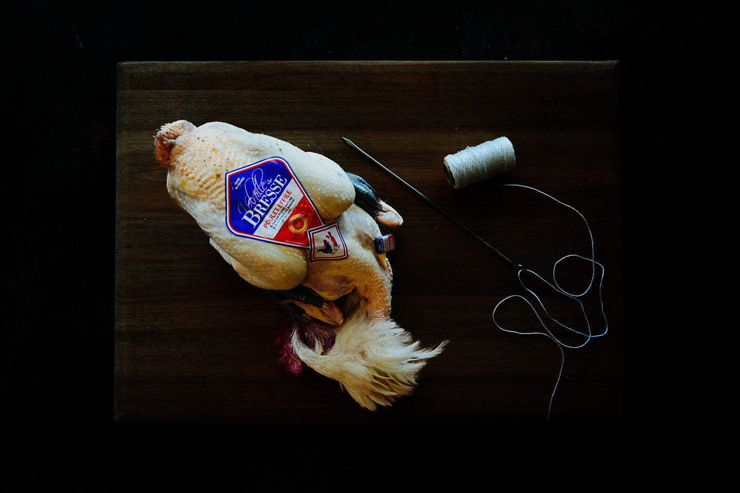 Whole Poulet de Bresse with characteristic tricolour origin tag