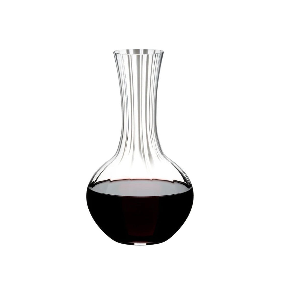 Riedel Performance Decanter with large bowl, long thin glass neck and widening opening for pouring. Half filled with Red Wine. Perfect for aerating fine wines 