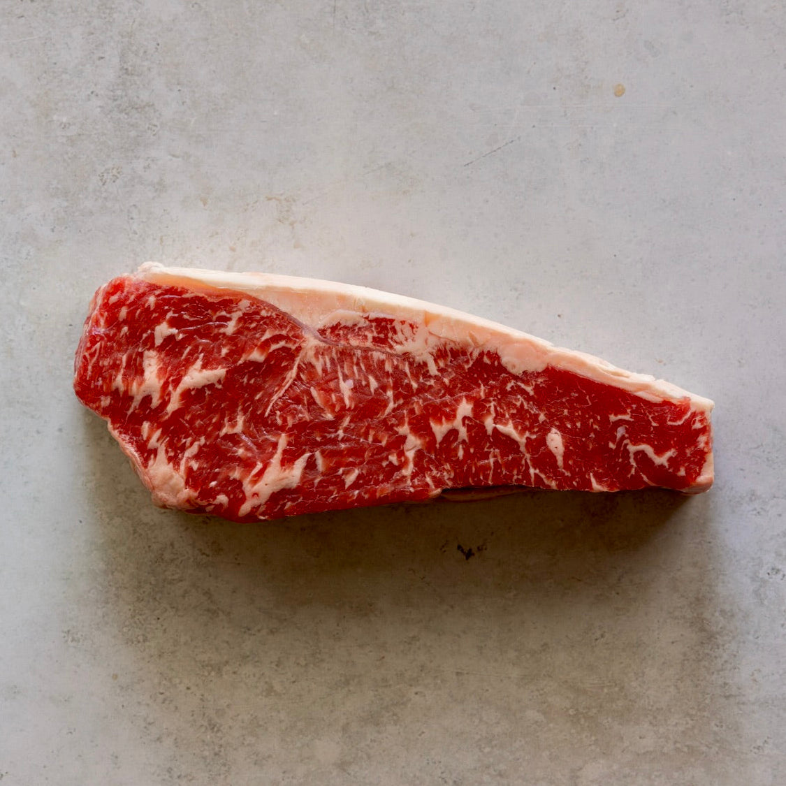 Stockyard Beef Sirloin Steak from FINE & WILD UK, showcasing premium Australian Black Angus marbling. Ideal for gourmet meat lovers and steak dishes.