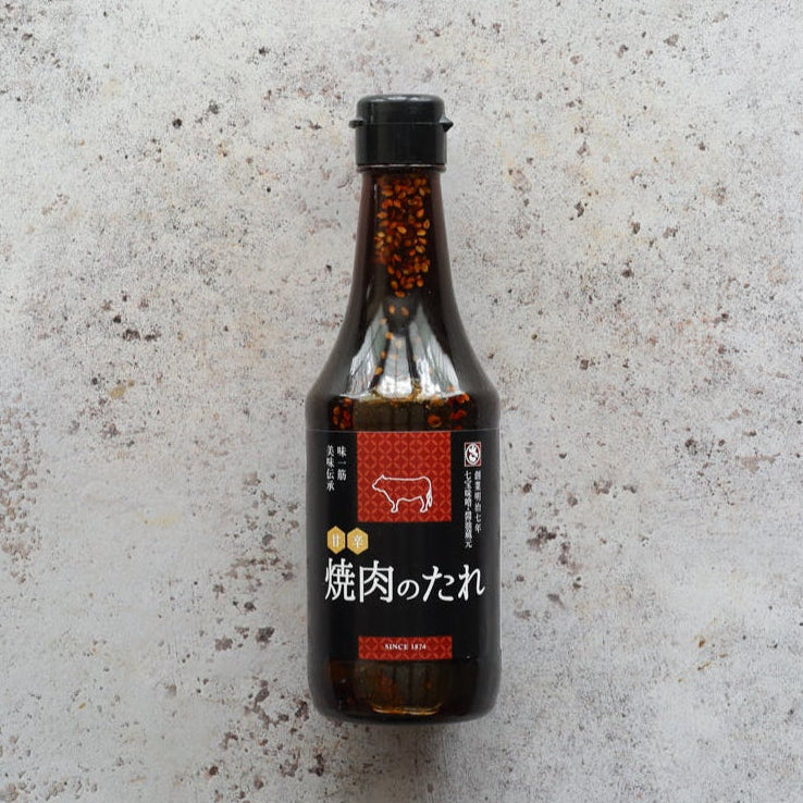 Yakiniku Sauce 300ml bottle by Sato Brewery with red label and sesame seeds, premium Japanese BBQ sauce from FINE & WILD UK.